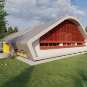A foto é uma maquete que mostra o exterior de um ginásio poliesportivo. O prédio tem um design moderno com telhado curvo em cinza. A fachada apresenta uma grande janela em arco com uma grade vermelha e, logo abaixo, faixas coloridas. A entrada é um painel amarelo. O ginásio está em uma área de gramado com árvores e um caminho pavimentado.